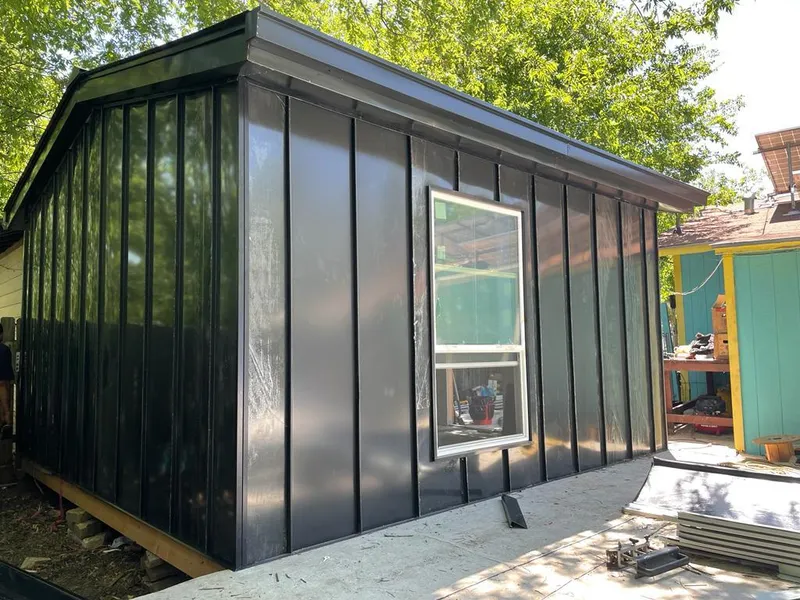 Black standing seam metal wall panels for Roof Inspection in Weymouth Town